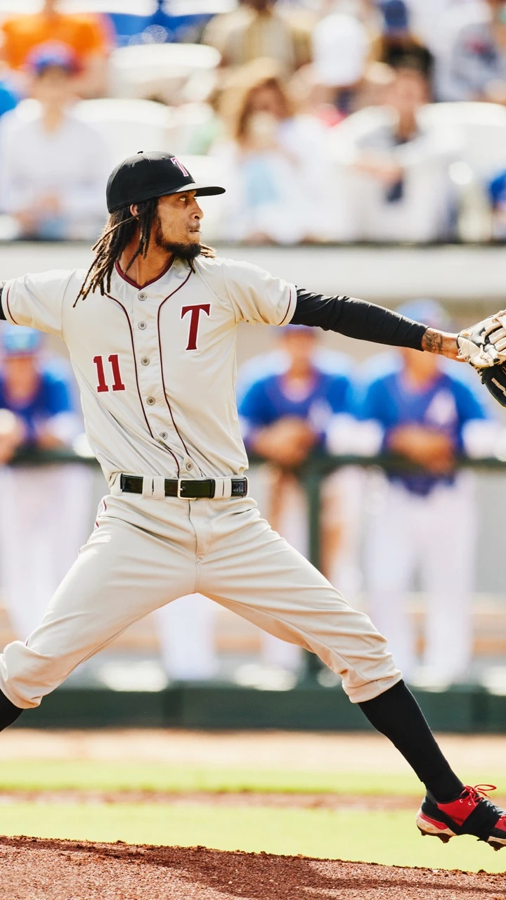 A man throwing a baseball