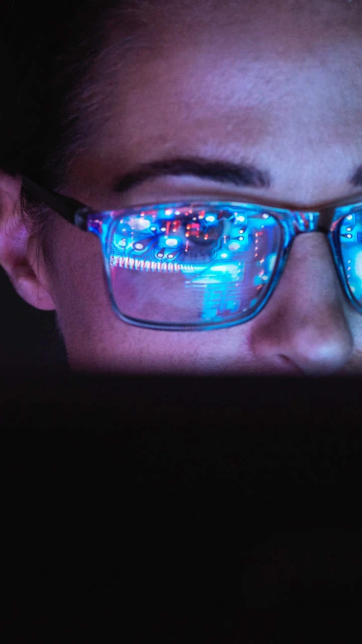 A person looking at a supercomputer