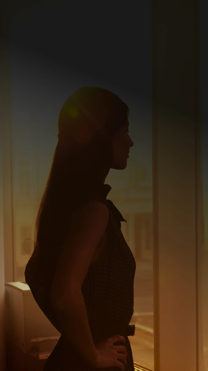 woman looking out of the window