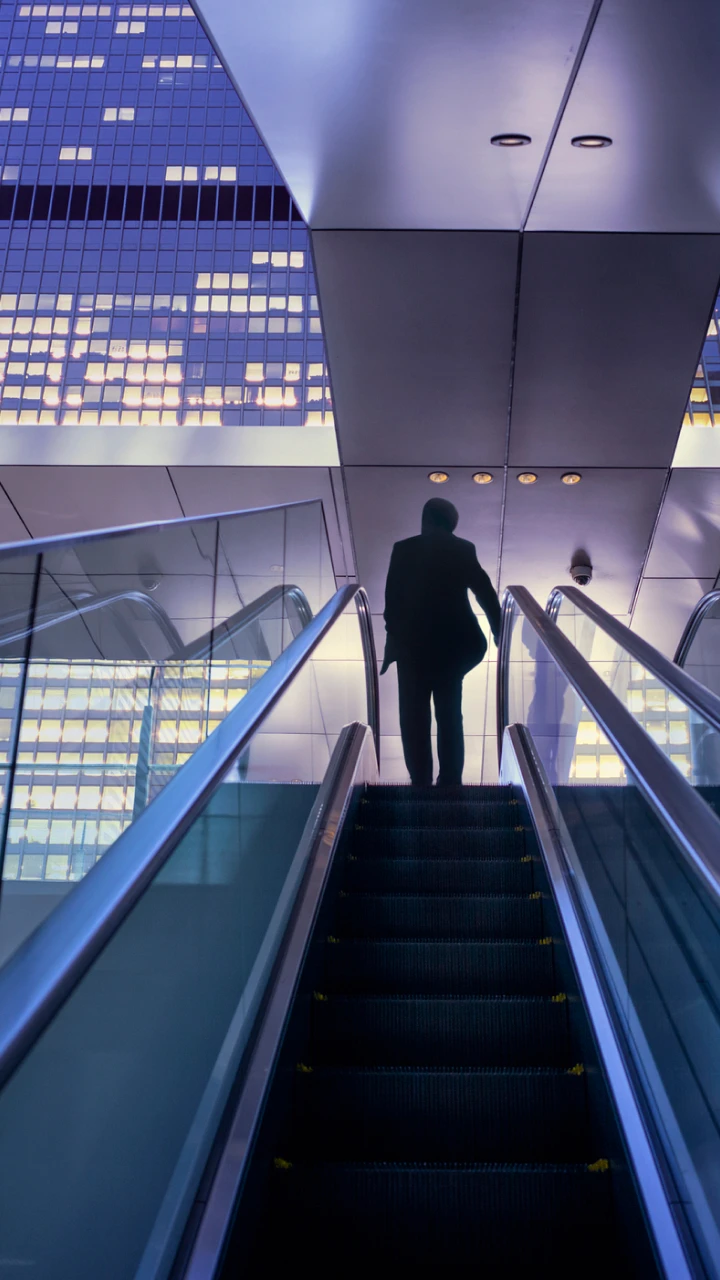 person on an escalator