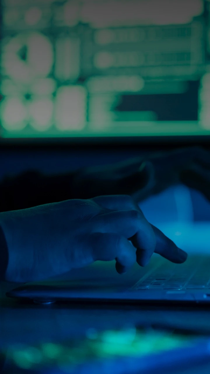 A person typing on a laptop