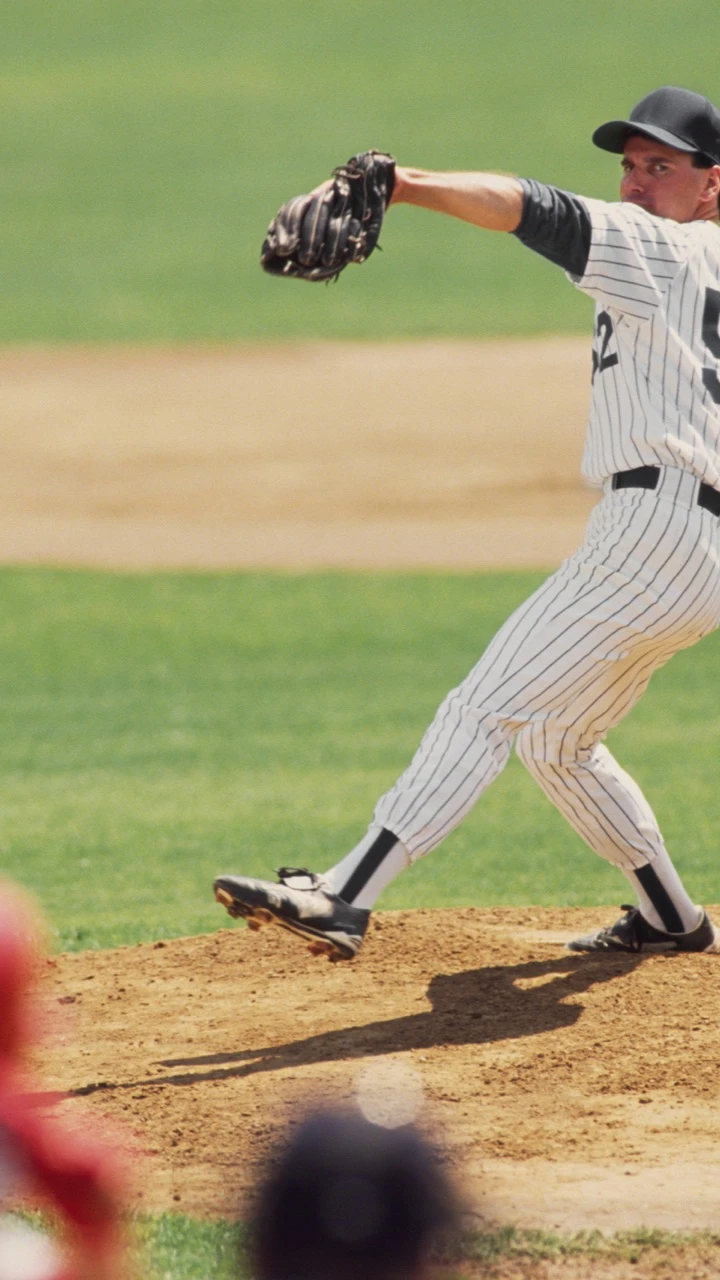 A baseball player throwing the ball